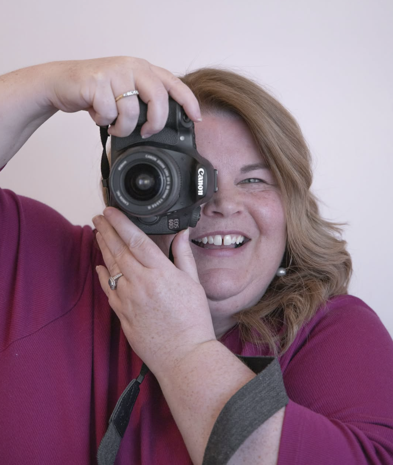 Kate of Kate Elizabeth Photography smiling behind her camera